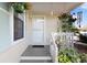 Welcoming front porch adorned with hanging flower baskets and decorative details at 1422 Baldwin Ct. # 1422, Little River, SC 29566