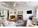 Bright and open living room features vaulted ceilings and a cozy fireplace at 1422 Baldwin Ct. # 1422, Little River, SC 29566