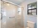 Walk-in shower features a glass door, updated fixtures, and a tiled surround, providing a modern feel at 1422 Baldwin Ct. # 1422, Little River, SC 29566