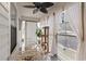 Bright sunroom with a glass table and chairs, sheer curtains, and a cat tree, perfect for relaxation at 1422 Baldwin Ct. # 1422, Little River, SC 29566