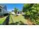 Landscaped backyard featuring a well-manicured lawn and privacy fence at 1424 Hydrangea Dr., Myrtle Beach, SC 29579