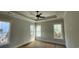 Well-lit bedroom with tray ceilings and multiple windows at 1424 Hydrangea Dr., Myrtle Beach, SC 29579