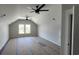Spacious upstairs bonus room with high ceilings and natural light from windows at 1424 Hydrangea Dr., Myrtle Beach, SC 29579
