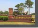 Community entrance sign with colorful landscaping and brick columns at 1424 Hydrangea Dr., Myrtle Beach, SC 29579