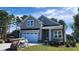 Charming two-story home featuring a two-car garage, landscaped yard, and welcoming front porch at 1424 Hydrangea Dr., Myrtle Beach, SC 29579