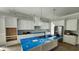 Modern kitchen with sleek white cabinets, stainless steel appliances, and a spacious island at 1424 Hydrangea Dr., Myrtle Beach, SC 29579