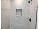 Modern shower with marble tiling and a built-in niche at 1424 Hydrangea Dr., Myrtle Beach, SC 29579