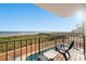 Private balcony with ocean views and seating area, perfect for enjoying the coastal breeze at 1501 Ocean Blvd. S # 103, North Myrtle Beach, SC 29582