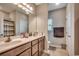 Bathroom featuring double sinks, vanity, large mirror, and tiled floor at 176 Springtide Dr., Conway, SC 29527
