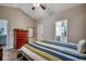 Bright bedroom featuring a ceiling fan, wood floors, and ensuite bathroom at 176 Springtide Dr., Conway, SC 29527