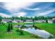 Beautiful community featuring a serene pond reflecting the sky and surrounding homes at 176 Springtide Dr., Conway, SC 29527