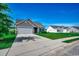 Charming single-Gathering home featuring a two-car garage, manicured lawn, and inviting curb appeal at 176 Springtide Dr., Conway, SC 29527
