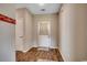 Entry way featuring wood-look floors, neutral paint, and a light-colored door at 176 Springtide Dr., Conway, SC 29527
