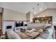 Cozy living room with vaulted ceilings, pendant lights, open kitchen, and a comfortable sectional sofa at 176 Springtide Dr., Conway, SC 29527