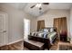 Relaxing main bedroom with ceiling fan and wood-look flooring at 176 Springtide Dr., Conway, SC 29527