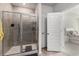 Bathroom featuring glass shower, tile surround, and an entry to the Primary bedroom at 179 Empyrean Circle, Myrtle Beach, SC 29588
