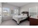 Bedroom featuring two windows, neutral carpet and an attached dresser at 179 Empyrean Circle, Myrtle Beach, SC 29588