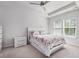 Bright bedroom featuring a ceiling fan, neutral carpet, and an abundance of natural light at 179 Empyrean Circle, Myrtle Beach, SC 29588
