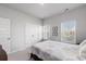 Bright bedroom featuring a large window, closet, and comfortable-looking queen bed at 179 Empyrean Circle, Myrtle Beach, SC 29588