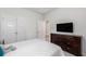 Bedroom with a TV on dresser, double closets, and an open door leading to another room at 179 Empyrean Circle, Myrtle Beach, SC 29588