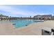 Large community pool surrounded by lounge chairs and tropical palm trees at 179 Empyrean Circle, Myrtle Beach, SC 29588