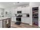 Bright kitchen equipped with stainless steel appliances and granite countertops at 179 Empyrean Circle, Myrtle Beach, SC 29588