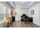 Bright office space featuring wood floors, tray ceiling, and a built-in workspace at 179 Empyrean Circle, Myrtle Beach, SC 29588