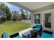 Covered patio with comfortable outdoor furniture, perfect for relaxing and enjoying the outdoors at 179 Empyrean Circle, Myrtle Beach, SC 29588