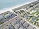 Scenic aerial view of beachfront homes and condos bordering a beautiful sandy beach and the vast ocean at 1801 N Ocean Blvd. # Q-2, North Myrtle Beach, SC 29582