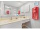 Bright bathroom featuring a cultured marble vanity with a framed mirror and white cabinets at 1801 N Ocean Blvd. # Q-2, North Myrtle Beach, SC 29582