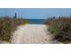 Sandy path to beach is framed by grasses at 1801 N Ocean Blvd. # Q-2, North Myrtle Beach, SC 29582