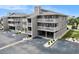 Three-story condo building showcases covered parking, multiple decks, neutral color palette, and well-maintained landscaping at 1801 N Ocean Blvd. # Q-2, North Myrtle Beach, SC 29582