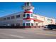 A multi-story grocery store styled as a lighthouse with white and red accents at 1801 N Ocean Blvd. # Q-2, North Myrtle Beach, SC 29582