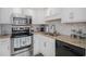 Updated kitchen features stainless steel appliances, granite counters, and tiled backsplash at 1801 N Ocean Blvd. # Q-2, North Myrtle Beach, SC 29582