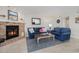 Charming living room featuring a brick fireplace, comfortable seating, and stylish decor at 1801 N Ocean Blvd. # Q-2, North Myrtle Beach, SC 29582