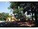 Outdoor community playground with slides, climbing structures, and picnic tables under a shady tree at 1801 N Ocean Blvd. # Q-2, North Myrtle Beach, SC 29582