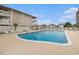 Community pool surrounded by lounge chairs and condominiums under a blue sky at 1801 N Ocean Blvd. # Q-2, North Myrtle Beach, SC 29582