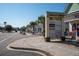 Shops on Main sign near a sidewalk lined with storefronts and palm trees in a commercial district at 1801 N Ocean Blvd. # Q-2, North Myrtle Beach, SC 29582