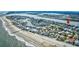 Wide aerial view of a coastal community on a peninsula with ocean and canal access for boating at 1924 Pompano Dr., Garden City Beach, SC 29576