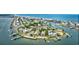 Expansive aerial view of an oceanfront community with houses, waterways, docks and boats, creating a vibrant coastal lifestyle at 1924 Pompano Dr., Garden City Beach, SC 29576