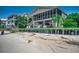 Enjoy the beautiful backyard with direct beach access, offering a private oasis for relaxation and recreation at 1924 Pompano Dr., Garden City Beach, SC 29576