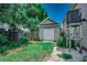 Charming backyard featuring a small outbuilding, lush lawn, and mature trees, providing a private outdoor space at 1924 Pompano Dr., Garden City Beach, SC 29576