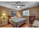 Bedroom with hardwood floors, plantation shutters, and nautical decor at 1924 Pompano Dr., Garden City Beach, SC 29576