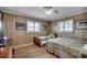 Bedroom with hardwood floors featuring two twin beds and plantation shutters at 1924 Pompano Dr., Garden City Beach, SC 29576