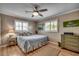 Bedroom with hardwood floors featuring art on the walls and plantation shutters at 1924 Pompano Dr., Garden City Beach, SC 29576
