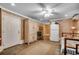 Spacious bedroom with tiled floors, ceiling fan, complemented by a refrigerator and ample storage space at 1924 Pompano Dr., Garden City Beach, SC 29576