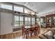 Dining area with natural light, hardwood floors, a dining table and views of the adjacent bedroom at 1924 Pompano Dr., Garden City Beach, SC 29576