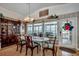 A formal dining room featuring an oval table, decorative lighting fixture, and floor to ceiling windows at 1924 Pompano Dr., Garden City Beach, SC 29576