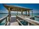 Covered dock area featuring a washing station overlooking the tranquil water at 1924 Pompano Dr., Garden City Beach, SC 29576