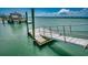 Wooden dock ramp leading to a pier with clear water all around at 1924 Pompano Dr., Garden City Beach, SC 29576